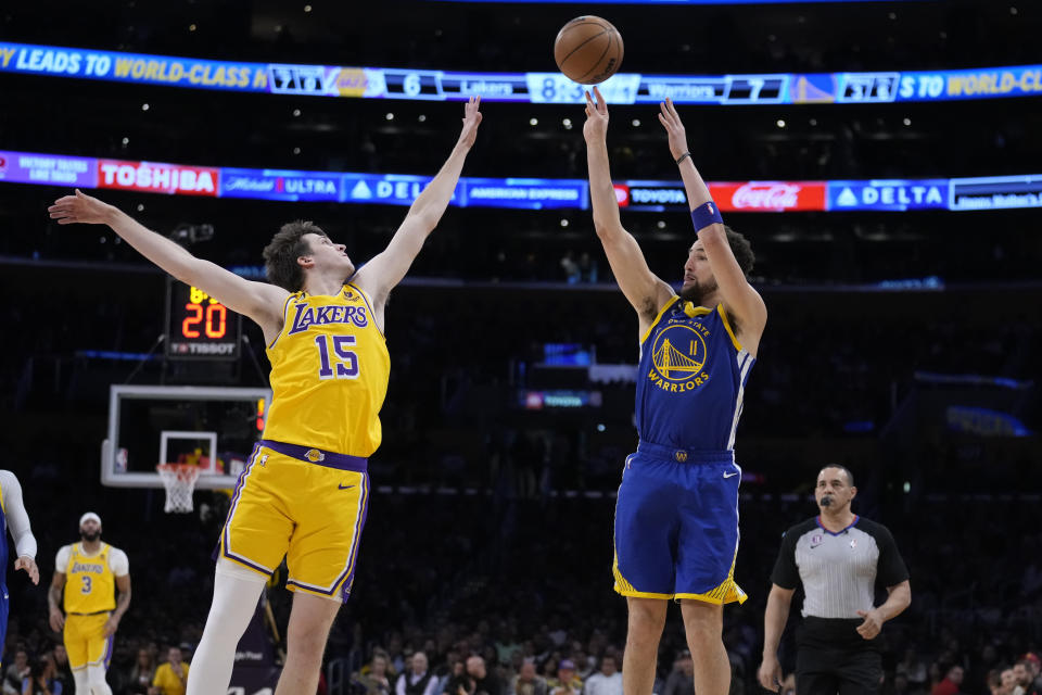 Golden State Warriors guard Klay Thompson, right, shoots as Los Angeles Lakers guard Austin Reaves defends during the first half in Game 4 of an NBA basketball Western Conference semifinal Monday, May 8, 2023, in Los Angeles. (AP Photo/Marcio Jose Sanchez)