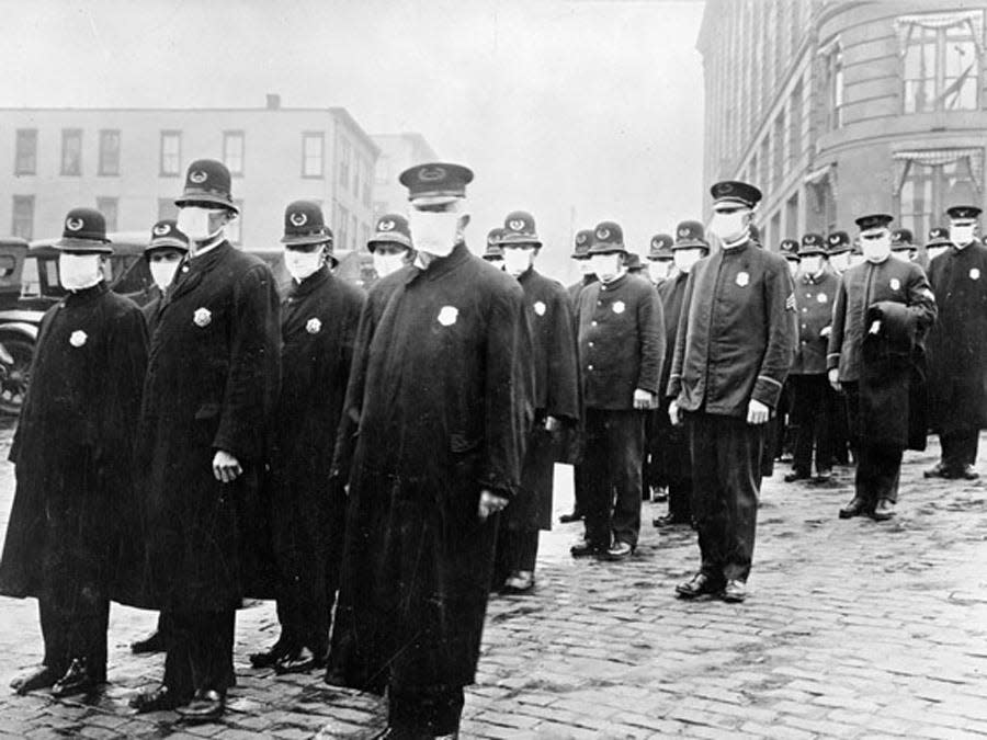 Seattle policemen wearing protective masks, 1918.