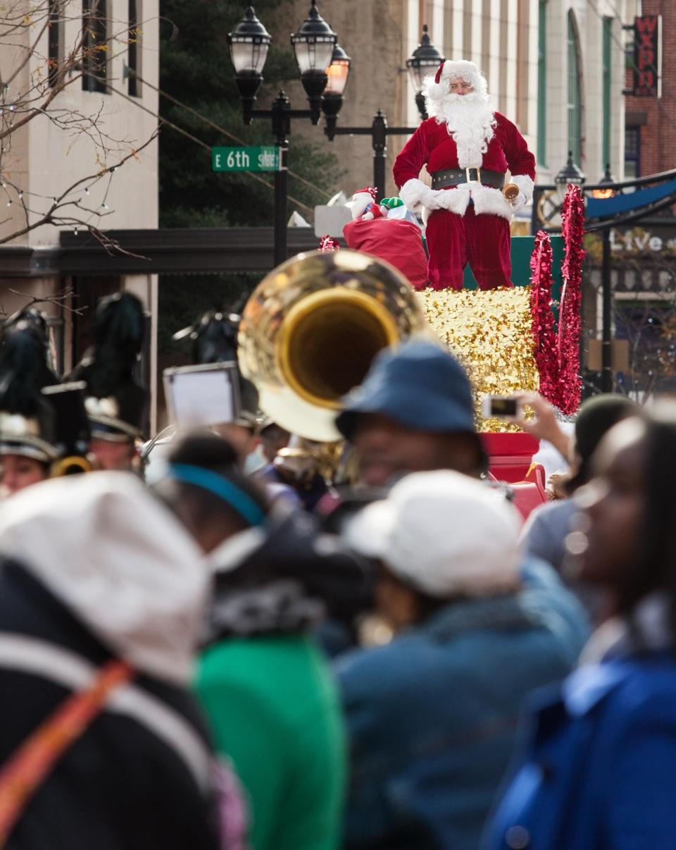 Santa Claus, shown last year, returns Saturday for the 51st annual Wilmington Jaycees Christmas Parade, coordinated with Small Business Saturday in the city. After the Market Street parade, Santa also will make appearances at small businesses in the city.