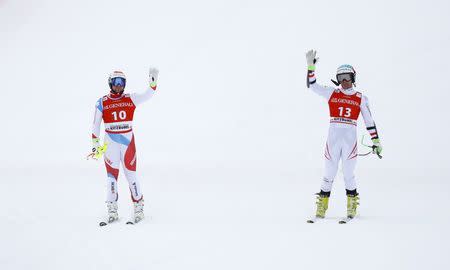 Alpine Skiing - FIS Alpine Skiing World Cup - Men's Alpine Super G - Kitzbuehel, Austria - January 19, 2018. Beat Feuz of Switzerland and Vincent Kriechmayr of Austria. REUTERS/Leonhard Foeger