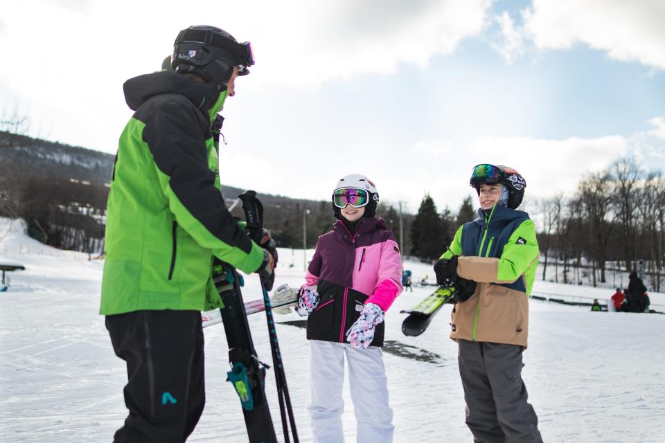 An instructor from Camelback interacts with students. Resorts in the Poconos offer snowsport enthusiasts with different ways to monitor conditions on the slopes, from apps to trail cams.