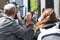 Britain's Prime Minister Boris Johnson's senior aid Dominic Cummings, centre, leaves his home, in London, Sunday, May 24, 2020. Several lawmakers from Britain’s governing Conservative Party have joined opposition calls for Johnson’s top aide to be fired for flouting lockdown rules. Dominic Cummings traveled 250 miles (400 kms) to his parents’ home with his wife and son as he was coming down with COVID-19 at the end of March. (AP Photo/Alberto Pezzali)