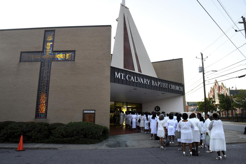 Ladies from Alpha Kappa Alpha sorority line up outside Mt. Calvary Baptist Church for the viewing of opera star Jessye Norman in Augusta, Ga., Thursday, Oct. 10, 2019. (Michael Holahan/The Augusta Chronicle via AP)