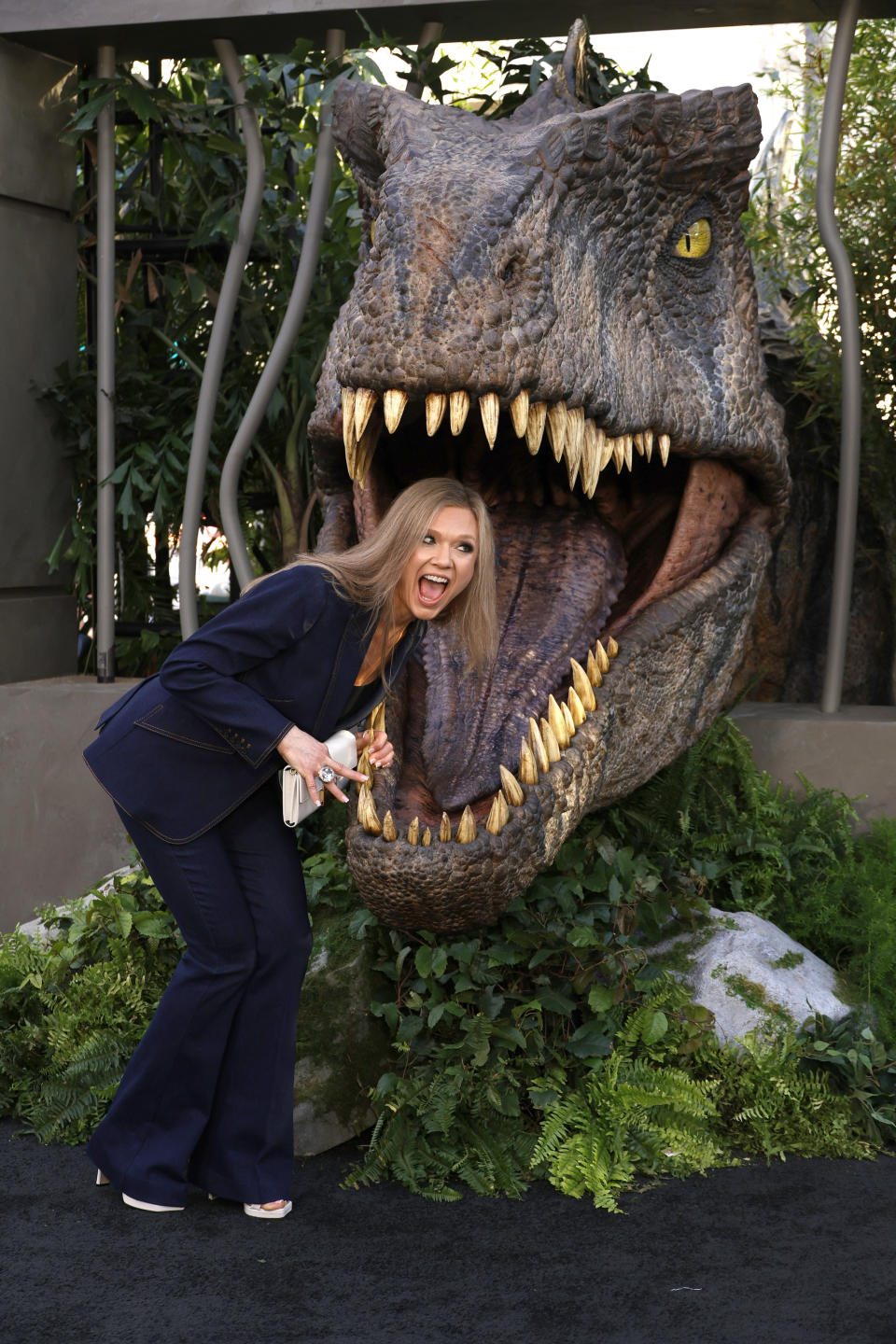 her posing with her head inside t-rex's mouth