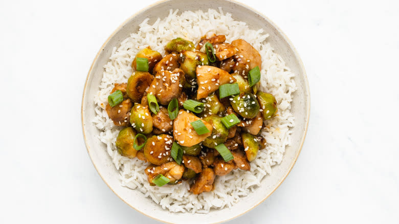 Chicken and Brussels sprouts stir fry in bowl