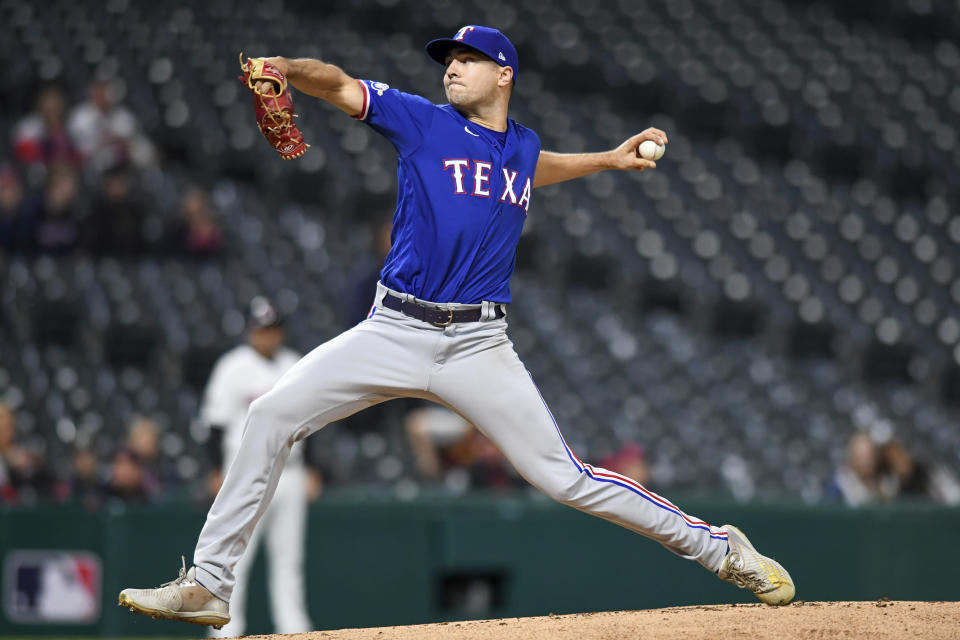 Texas Rangers' Brock Burke throws against the Cleveland Guardians during the fifth inning of a baseball game Wednesday, June 8, 2022, in Cleveland. (AP Photo/Nick Cammett)
