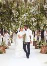 <p>Just weeks after her second fairytale wedding to Ben Affleck, Lopez shared several more sweet images from the happy affair. In this one, the singer (wearing her stunning Ralph Lauren gown) is seen embracing her new husband while walking down the aisle. </p>