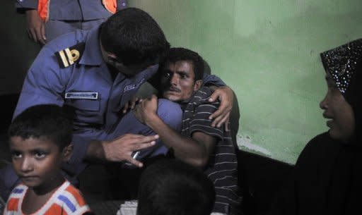 A Rohingya Muslim from Myanmar, who tried to cross the Naf river into Bangladesh to escape sectarian violence, cries in a Bangladeshi Coast guard station in Teknaf on June 19, 2012, before being sent back to Myanmar