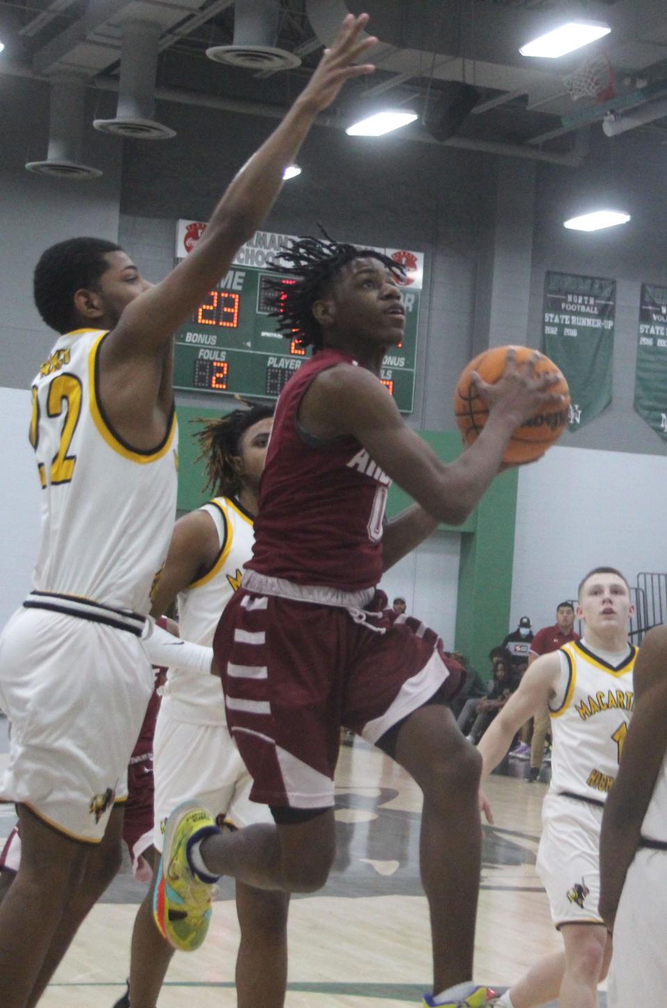 Ardmore's DD Coleman drives to the basket earlier this season. The senior led the Tigers with 24 points on Friday in a 66-59 loss to Southmoore in the semifinals of the John Nobles Invitational.