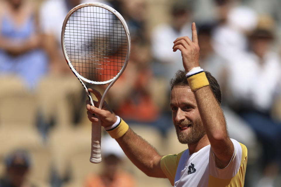 France's Constant Lestienne celebrates after winning a game against Russia's Karen Khachanov during their first round match of the French Open tennis tournament at the Roland Garros stadium in Paris, Sunday, May 28, 2023. (AP Photo/Aurelien Morissard)