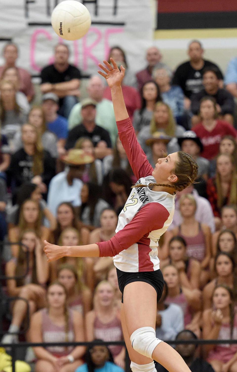 Germantown's Diana Wells (22) spikes the ball against Madison Central in the MHSAA Class 6A volleyball playoffs at Germantown High School in Gluckstadt, Miss., on Monday, October 17, 2022.
