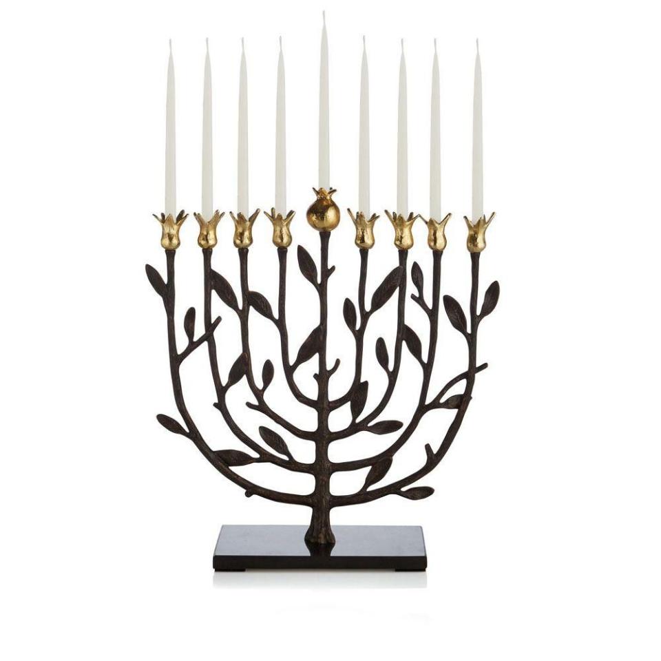 <p><strong>Michael Aram</strong></p><p>michaelaram.com</p><p><strong>$195.00</strong></p><p><a href="https://www.michaelaram.com/collections/judaica/products/pomegranate-kosher-menorah" rel="nofollow noopener" target="_blank" data-ylk="slk:Shop Now;elm:context_link;itc:0;sec:content-canvas" class="link ">Shop Now</a></p><p>The thing about a gift of Judaica is that it becomes a part of your recipient’s life during happy traditions for many years to come — so it’s like a gift that keeps on giving. This menorah will do just that, with an elegant pomegranate motif that symbolizes life, rebirth, and renewal (plus fertility and union, so it’s great for an engaged or newlywed couple).</p>