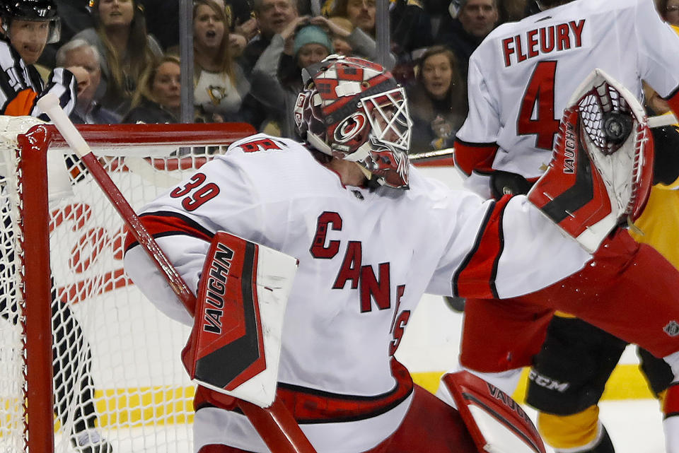 Carolina Hurricanes goaltender Alex Nedeljkovic (39) makes a save against the Pittsburgh Penguins during the second period of an NHL hockey game, Sunday, March 8, 2020, in Pittsburgh. (AP Photo/Keith Srakocic)