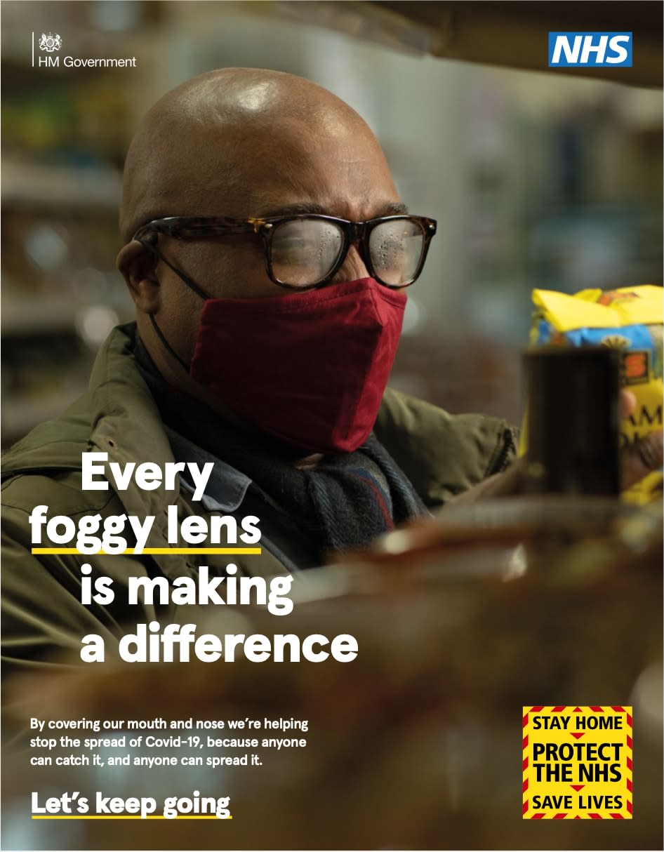 Britons are urged to keep staying at home in a new campaign. This poster reads: 'every foggy lens is making a difference', and features a man with steamed up glasses wearing a face mask - News Scans