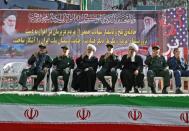Iranian military officials and clerics attend a funeral on September 24, 2018 for victims of a weekend attack on a military parade in the southwestern Iranian city of Ahvaz