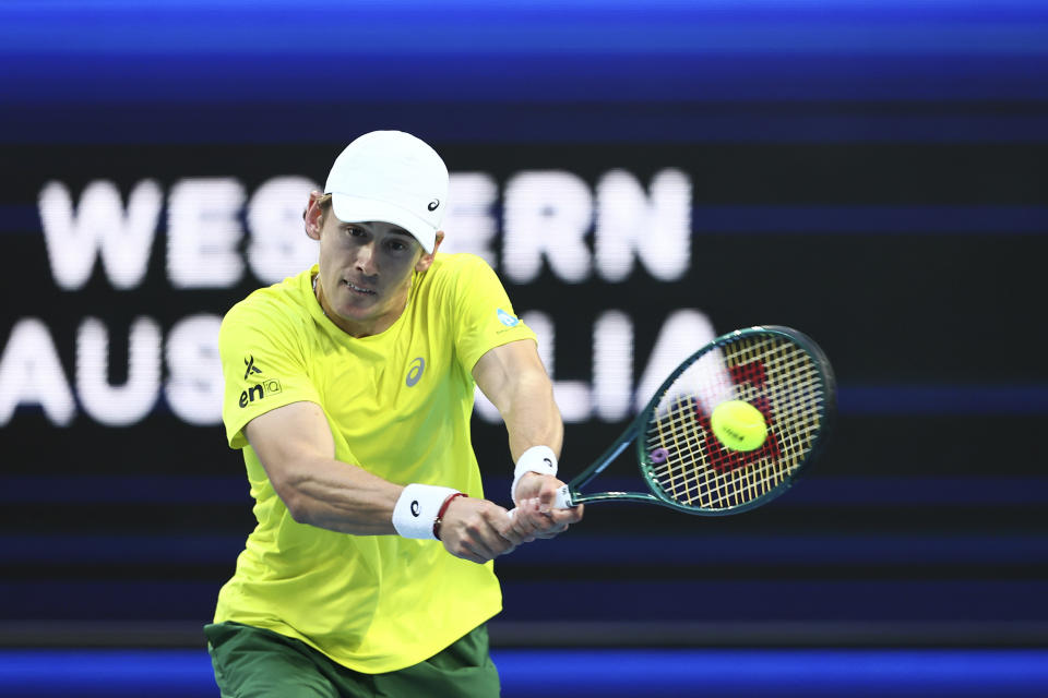 Alex de Minaur of Australia hits a return to Novak Djokovic of Serbia during the United Cup tennis tournament in Perth, Australia, Wednesday, Jan. 3, 2024. (AP Photo/Trevor Collens)