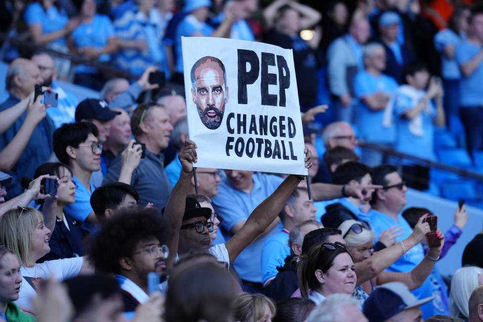 Manchester City supporters celebrate Premier League title after the English Premier League soccer match between Manchester City and Chelsea at the Etihad Stadium in Manchester, England, Sunday, May 21, 2023. (AP Photo/Jon Super)