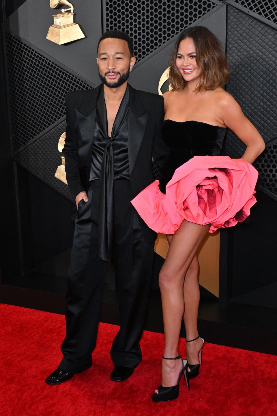 Chrissy Teigen and John Legend attend the 2024 Grammys.