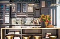 <p>Before permanently moving to live on the West Coast, John Legend and Chrissy Teigen had a wonderfully cozy, dark <a rel="nofollow noopener" href="http://www.thedailymeal.com/eat/food-scientist-s-lab-his-kitchen-new-york-s-ben-jack-s-steakhouse?referrer=yahoo&category=beauty_food&include_utm=1&utm_medium=referral&utm_source=yahoo&utm_campaign=feed" target="_blank" data-ylk="slk:New York kitchen;elm:context_link;itc:0;sec:content-canvas" class="link "><strong>New York kitchen</strong></a>. With bright, bold stools, a unique, custom-made backsplash, and dark wood <a rel="nofollow noopener" href="http://www.thedailymeal.com/eat/dream-kitchens-slideshow/slide-7?referrer=yahoo&category=beauty_food&include_utm=1&utm_medium=referral&utm_source=yahoo&utm_campaign=feed" target="_blank" data-ylk="slk:cabinets;elm:context_link;itc:0;sec:content-canvas" class="link "><strong>cabinets</strong></a>, this kitchen is <a rel="nofollow noopener" href="http://www.thedailymeal.com/east-coast-wings-grill-unveils-new-limited-time-menu-offerings?referrer=yahoo&category=beauty_food&include_utm=1&utm_medium=referral&utm_source=yahoo&utm_campaign=feed" target="_blank" data-ylk="slk:East Coast;elm:context_link;itc:0;sec:content-canvas" class="link "><strong>East Coast</strong></a>-perfect, but is incredibly different from what they have in their new <a rel="nofollow noopener" href="http://www.thedailymeal.com/11-west-coast-red-wines-worth-trying?referrer=yahoo&category=beauty_food&include_utm=1&utm_medium=referral&utm_source=yahoo&utm_campaign=feed" target="_blank" data-ylk="slk:West Coast;elm:context_link;itc:0;sec:content-canvas" class="link "><strong>West Coast</strong></a> mansion.</p><p><a rel="nofollow noopener" href="http://www.thedailymeal.com/entertain/20-reasons-food-world-loves-chrissy-teigen-slideshow/slide-1?referrer=yahoo&category=beauty_food&include_utm=1&utm_medium=referral&utm_source=yahoo&utm_campaign=feed" target="_blank" data-ylk="slk:Click here to see why the food world loves Chrissy Teigen.;elm:context_link;itc:0;sec:content-canvas" class="link "><strong>Click here to see why the food world loves Chrissy Teigen.</strong></a></p>