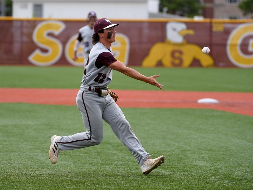 Snow Hill's Cole Swift (12) tosses the ball to first for the out against Colonel Richardson in the state semifinals Wednesday, May 25, 2022, at Salisbury University in Salisbury, Maryland. Colonel Richardson defeated Snow Hill 6-4