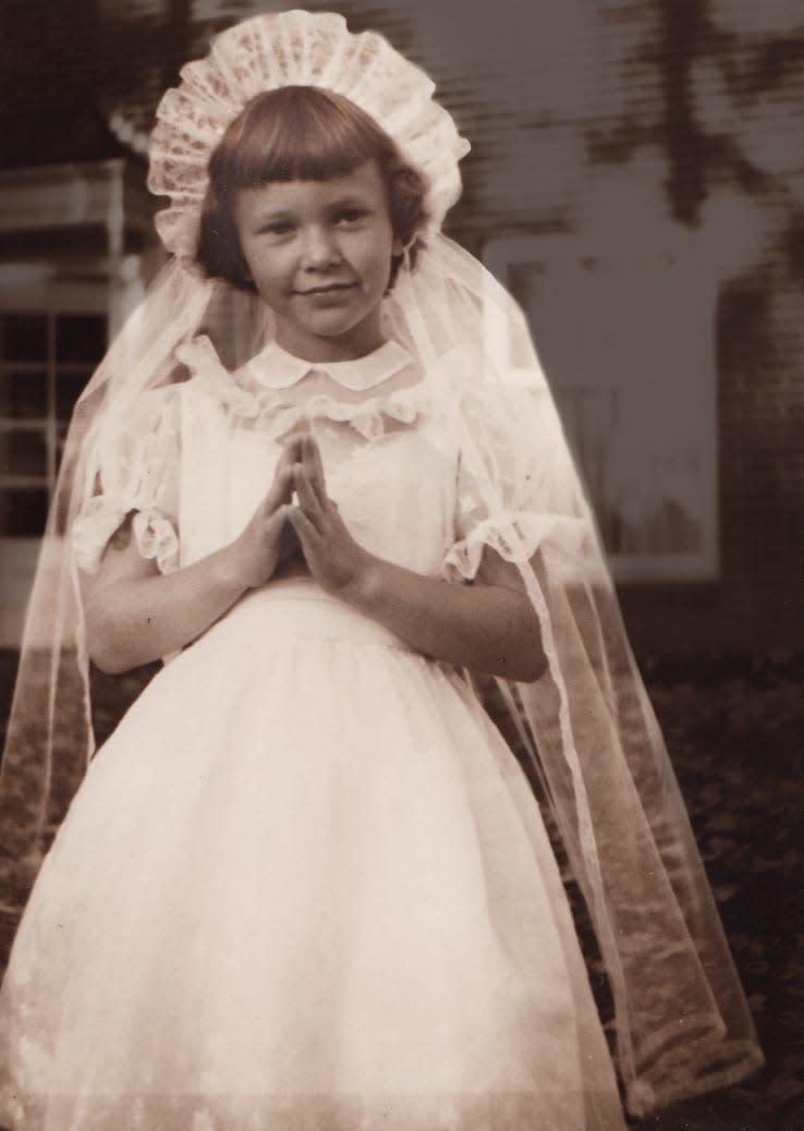 Nancy Noel, shown here during her First Communion, grew up in Indianapolis and spent summers with her family on Walloon Lake in Michigan.