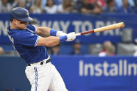 Toronto Blue Jays' Matt Chapman hits a single against the Baltimore Orioles during the first inning of a baseball game Monday, Aug. 15, 2022, in Toronto. (Jon Blacker/The Canadian Press via AP)