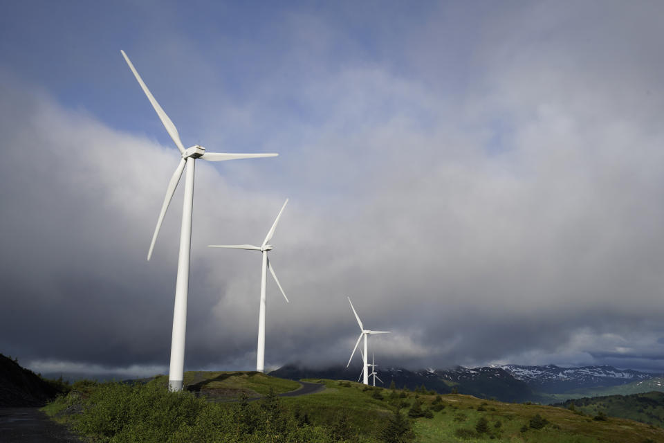 FILE - Wind turbines work on Sunday, June 25, 2023, in Kodiak, Alaska. To meet the goal of limiting global warming to 1.5 degrees Celsius (2.7 degrees Fahrenheit), nine major Asian economies must increase the share of electricity they get from renewable energy from the current 6% to at least 50% by 2030, according to a report by a German thinktank released Wednesday, Nov. 15, 2023. (AP Photo/Joshua A. Bickel, File)