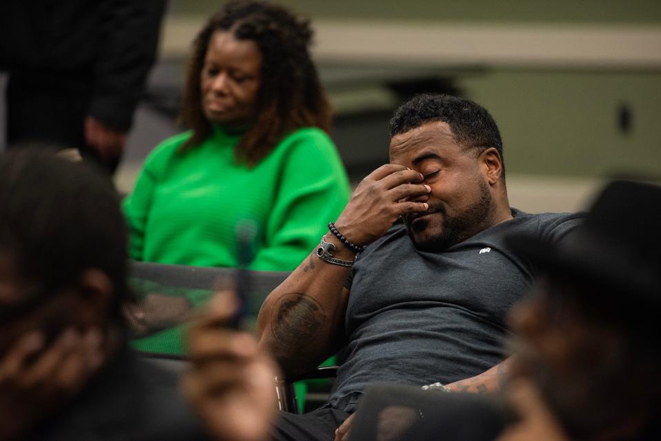 Bertron Beard, an army lieutenant, holds his face in his hands as he listens to crimes the Goon Squad committed during a town hall meeting about police brutality in Rankin County hosted by the Rankin County NAACP at the Brandon Public Library in Brandon on Tuesday. Beard was stationed here last year, and 'Goon Squad' was the first thing that popped up when they researched the area. "It's worse than we thought," Beard said.