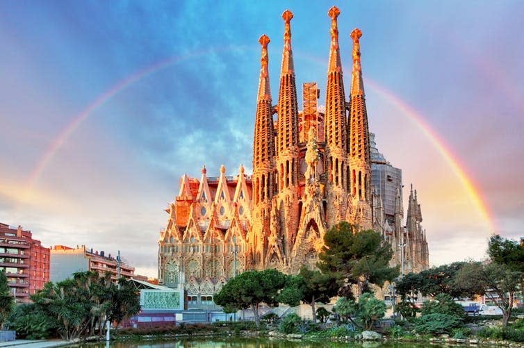 <span class="caption">Barcelona’s Sagrada Familia attracts hundreds of thousands of tourists – perhaps too many.</span> <span class="attribution"><a class="link " href="https://www.shutterstock.com/image-photo/barcelona-spain-feb-10-view-sagrada-631910561?src=9lPOCSCE6PGdY98zVg6rsw-1-14" rel="nofollow noopener" target="_blank" data-ylk="slk:Shutterstock;elm:context_link;itc:0;sec:content-canvas">Shutterstock</a></span>