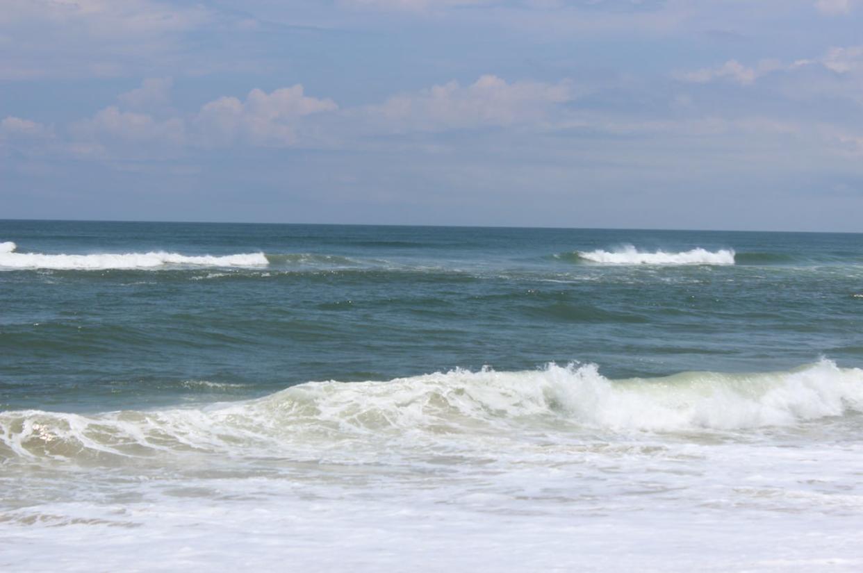 The gap between breaking waves in North Carolina indicates a rip current flowing away from shore. <a href="https://www.weather.gov/images/safety/photo/rip_nc18-1.JPG" rel="nofollow noopener" target="_blank" data-ylk="slk:National Weather Service;elm:context_link;itc:0;sec:content-canvas" class="link ">National Weather Service</a>