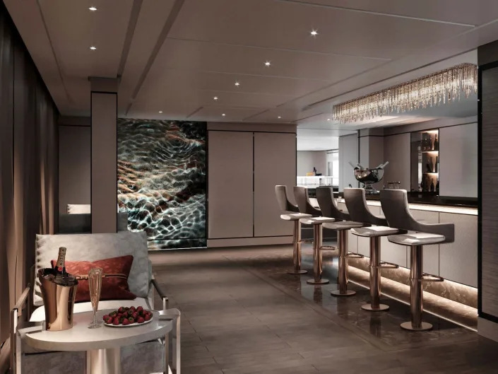 A rendering of a bar with bar seating, a side table on the Ritz-Carlton Evrima.
