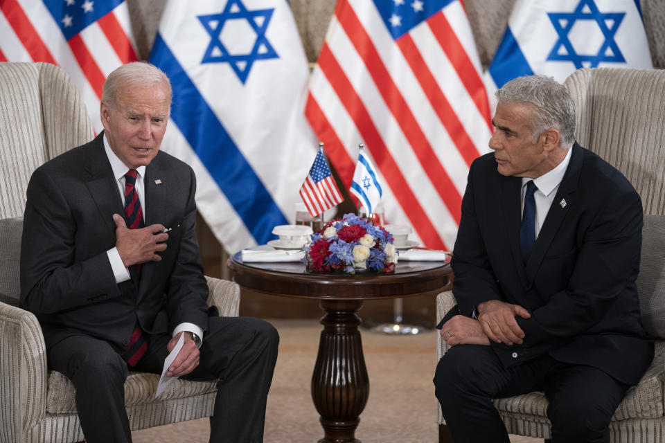 President Joe Biden, left, and Israeli Prime Minister Yair Lapid address the media following their meeting in Jerusalem Thursday, July 14, 2022. (AP Photo/Evan Vucci)