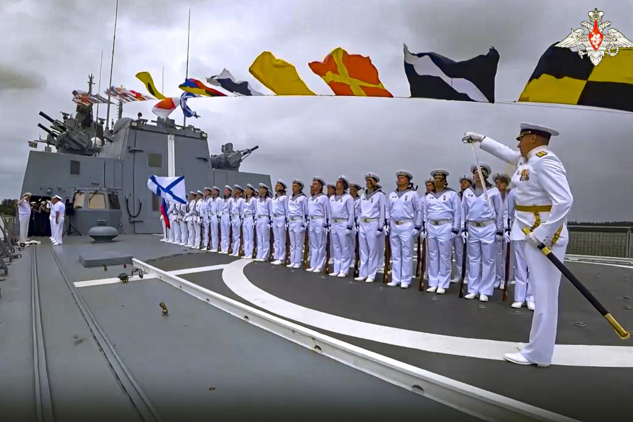 In this handout photo taken from video released by Russian Defense Ministry Press Service on Wednesday, Feb. 22, 2023, Russian military sailors stand in solemn formation onboard of the Admiral Gorshkov frigate of the Russian navy in Richards Bay, South Africa. Russia's Admiral Gorshkov frigate arrived at Richards Bay, South Africa, to participate in naval drills of Russia, South Africa and China, the Russian military said Wednesday. (Russian Defense Ministry Press Service via AP)