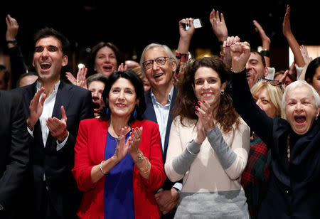 Salome Zurabishvili, presidential candidate supported by the governing Georgian Dream party, with her daughter Ketevan and son Teimuraz react after the announcement of the first exit polls in the presidential election in Tbilisi, Georgia October 28, 2018. REUTERS/David Mdzinarishvili