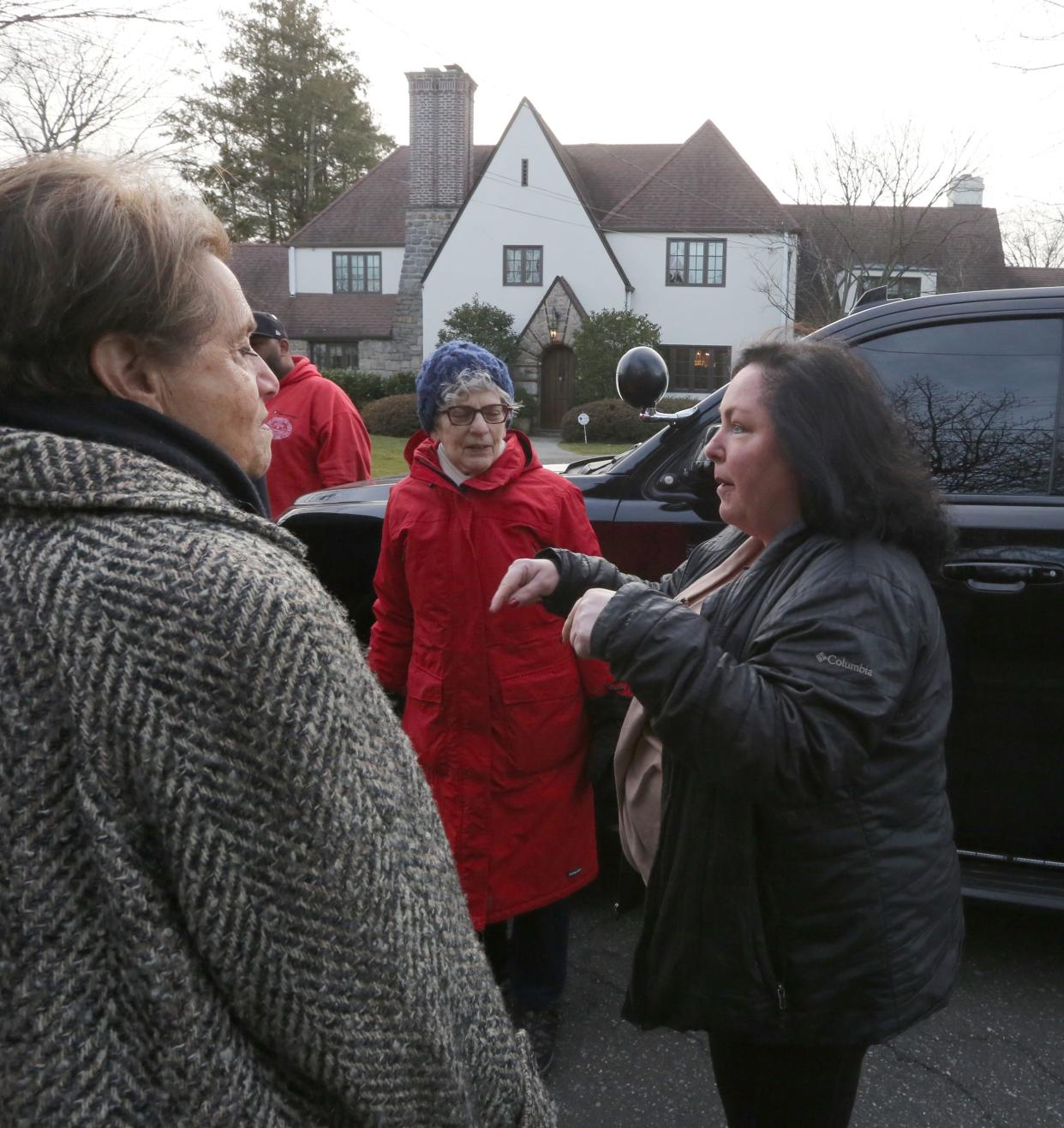 Mt. Vernon City Council President Cathlin Gleason, right, talks to a group of Bronxville and Mt. Vernon residents in Bronxville March 1, 2024. They are concerned that a flood control project will cause flooding in their neighborhoods.