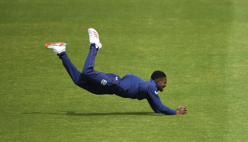 West Indies Keon Harding of West Indies takes the catch off Raymon Reifer during day three of a West Indies Warm Up match at Old Trafford in Manchester, England, Wednesday July 1, 2020. England are scheduled to play West Indies in their first international Test match on July 8-12. (Gareth Copley/Agency Pool via AP)