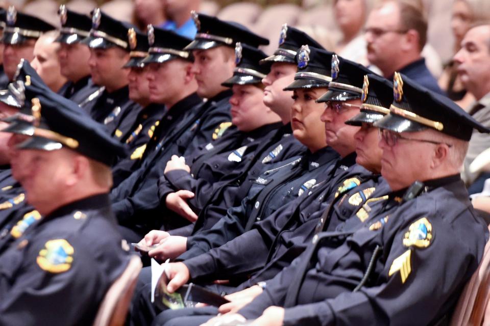 Niceville Police officers gather Friday at the Mattie Kelly Arts Center in Niceville to mourn and remember Niceville K-9 Officer Blue, who was killed in an Aug. 7 vehicle accident that also seriously injured his partner, Sgt. Phillip Ritcheson.