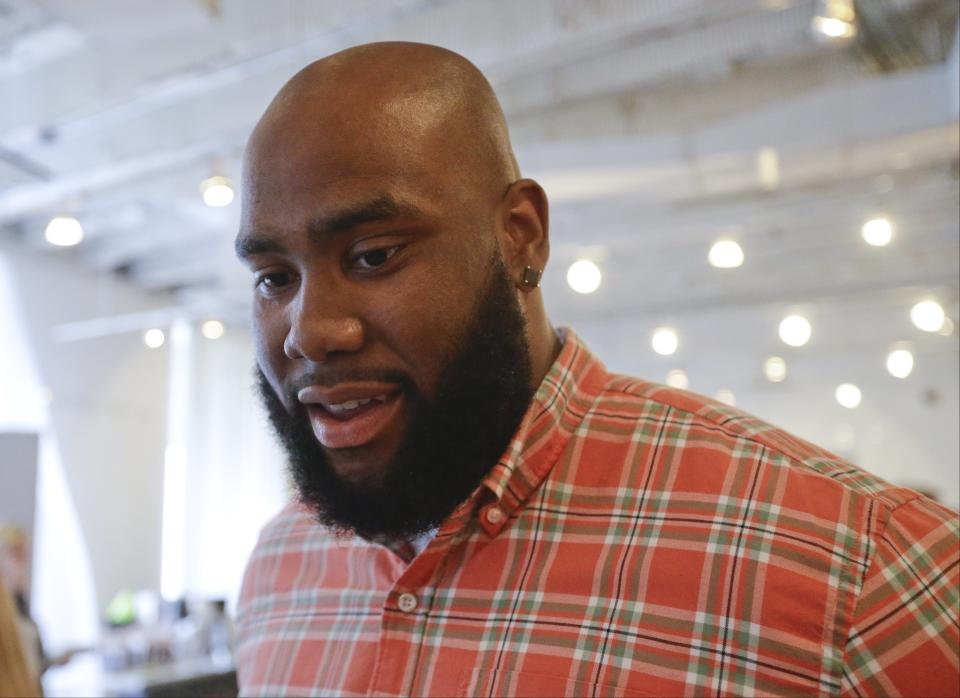 This May 6, 2014 photo shows NFL Draft prospect Morgan Moses, an offensive tackle from Virginia, during an interview at the 5th Annual NFL Pre-Draft Gifting & Style Suite at the Sean John showroom in New York. Moses is among dozens of prospects on the National Football League's annual draft, with 32 players per round and seven rounds, beginning Thursday night at Radio City. (AP Photo/Frank Franklin II)