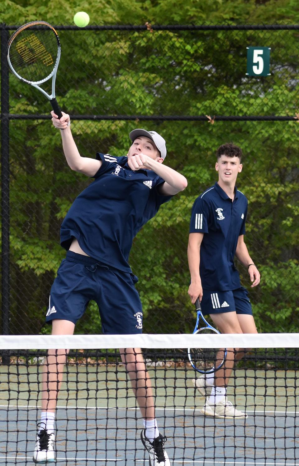 Somerset Berkley second double players Ian Jepson leaps high for a shot in the front as teammate Ian Sullivan watches in Thursday's match against Seekonk at Chapman's Court in Somerset..
