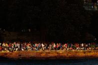 SYDNEY, AUSTRALIA - DECEMBER 31: People line the harbour in anticipation of New Years Eve celebrations on Sydney Harbour on December 31, 2012 in Sydney, Australia. (Photo by Brendon Thorne/Getty Images)