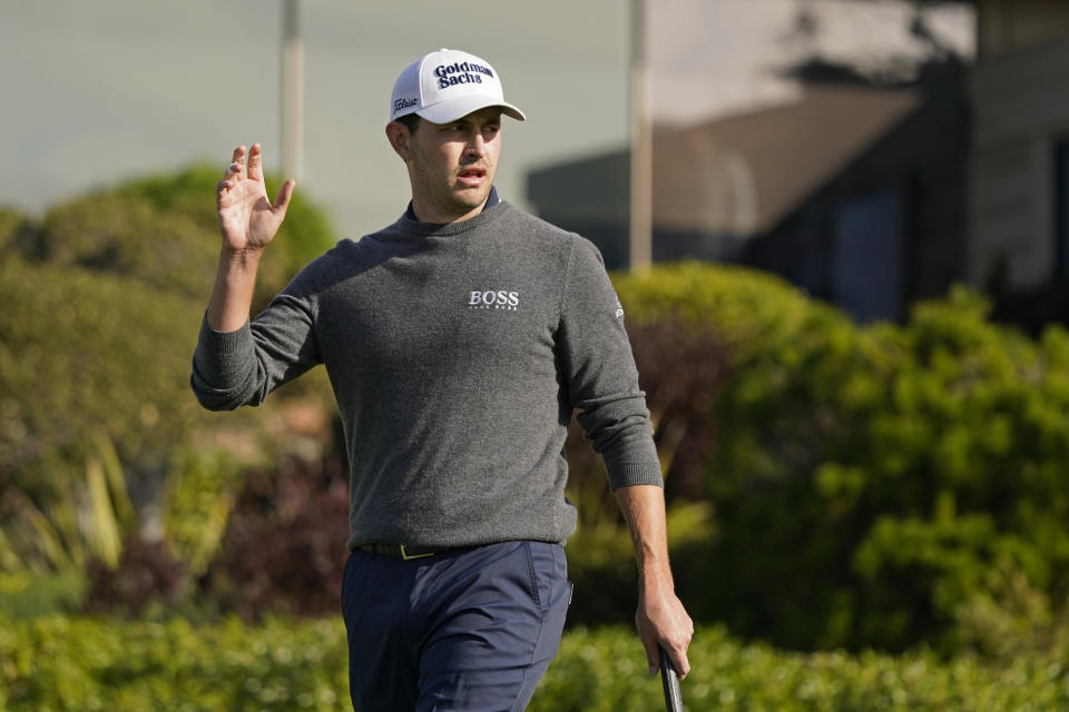 Patrick Cantlay reacts after making a birdie on the first green of the Pebble Beach Golf Links during the third round of the AT&T Pebble Beach Pro-Am golf tournament in Pebble Beach, Calif., Saturday, Feb. 5, 2022. (AP Photo/Eric Risberg)