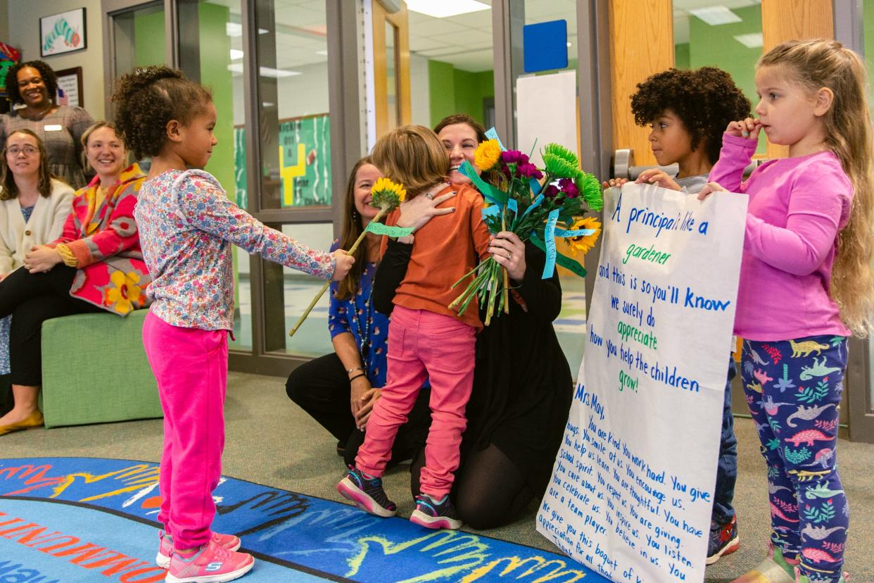 Students congratulate Christianne May for being named Southeast Region Principal of the Year. May is the principal at Castle Hayne Elementary School.