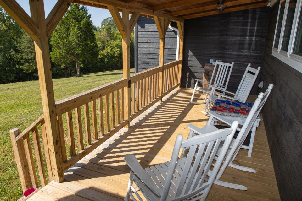 The porch is filled with white rocking chairs at the home of Victor and Kathleen Fleek in Coxs Creek, Kentucky. The property is 32 acres and has plenty of space to feel secluded. Sept. 24, 2021