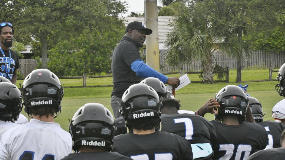 First-year Park Vista football coach Leonard Weaver III talks to his players during a recent practice.