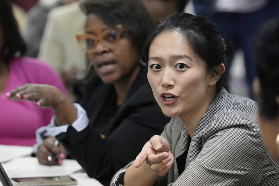 Leah Wong, an attorney with the NAACP Legal Defense Fund, asks a question to the Hinds County Election Commissioners during a special commission meeting, Monday, Dec. 18, 2023, in Jackson, Miss. The commission and representatives of a coalition of national and local civil rights organizations discussed the ballot shortages, technical mishaps and insufficient training that hampered voting in Mississippi's largest county during the Nov. 7 general election. (AP Photo/Rogelio V. Solis)