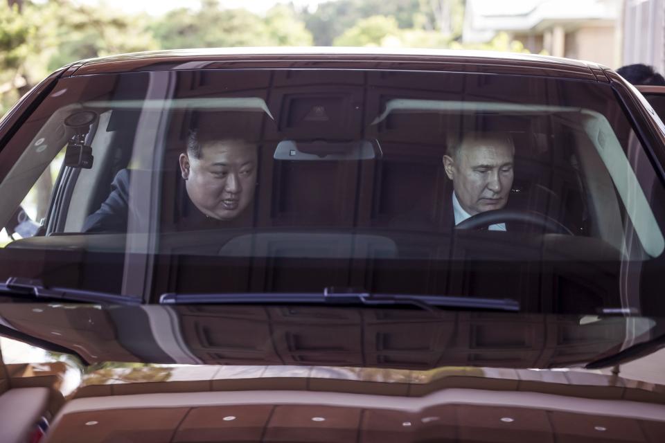 Russian President Vladimir Putin, right, and North Korea's leader Kim Jong Un drive a Russian Aurus limousine during their meeting in Pyongyang, North Korea, on Wednesday, June 19, 2024. (Gavriil Grigorov, Sputnik, Kremlin Photo via AP)