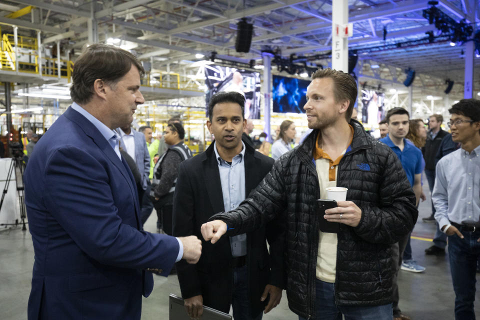 DEARBORN, MI - APRIL 26: Ford CEO Jim Farley (L) speaks with employees at the launch of the all-new electric Ford F-150 Lightning pickup truck at the Ford Rouge Electric Vehicle Center on April 26, 2022 in Dearborn, Michigan. The F-150 Lightning is positioned to be the first full-size all-electric pickup truck to go on sale in the mainstream U.S. market. (Photo by Bill Pugliano/Getty Images)