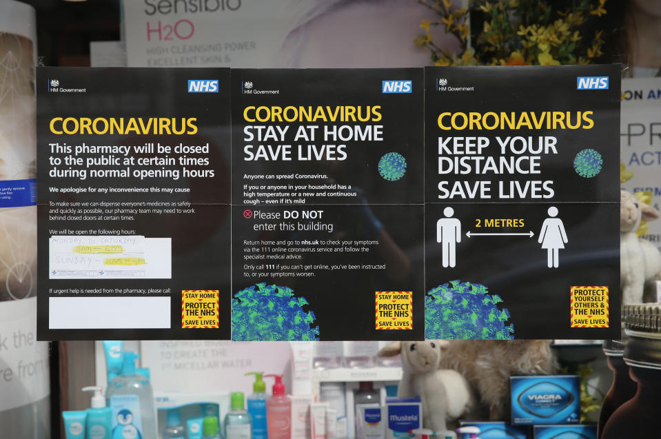 NHS information signs on covid-19 are displayed outside a pharmacy in Portobello Road, west London, as the UK continues in lockdown to help curb the spread of the coronavirus. Picture date: Sunday April 26, 2020. 