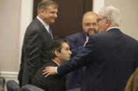 Defense attorneys Don McCune (L), Andy Savage and Miller Shealy surround former North Charleston police officer Michael Slager after a note was sent by the jury as they continue to deliberate at the Charleston County court in Charleston, South Carolina, December 5, 2016. REUTERS/Grace Beahm/Post and Courier/Pool