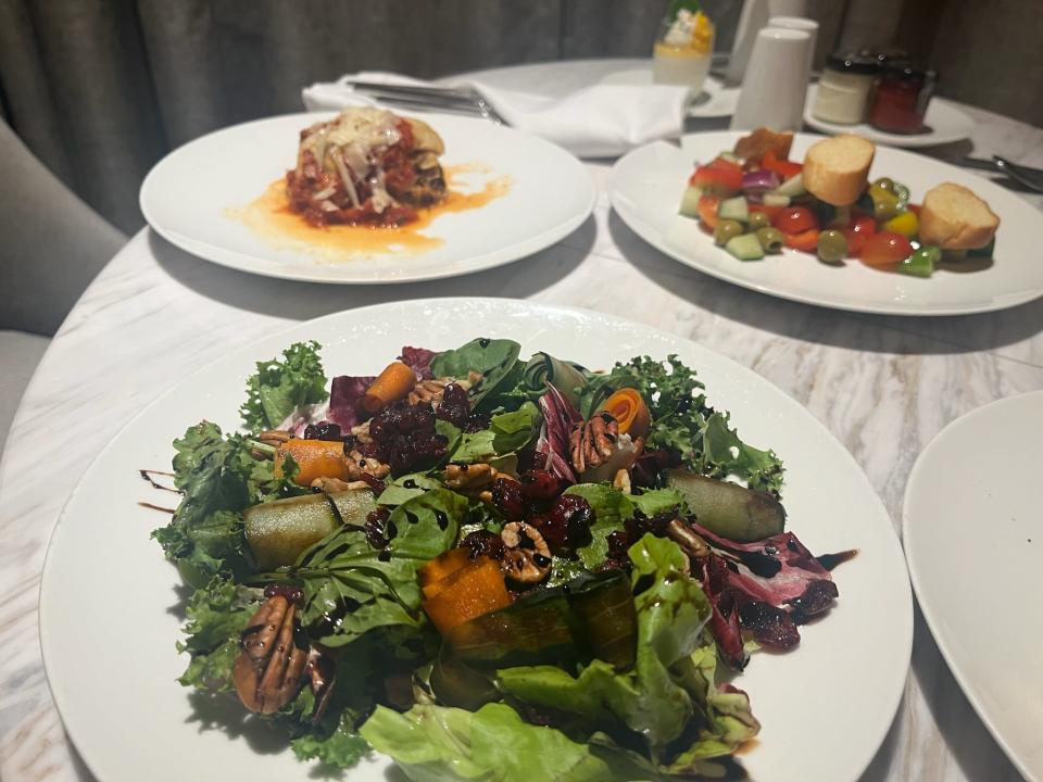 plates of food on a table at a restaurant in an all-inclusive resort